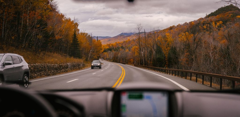 car driving in middle of nature